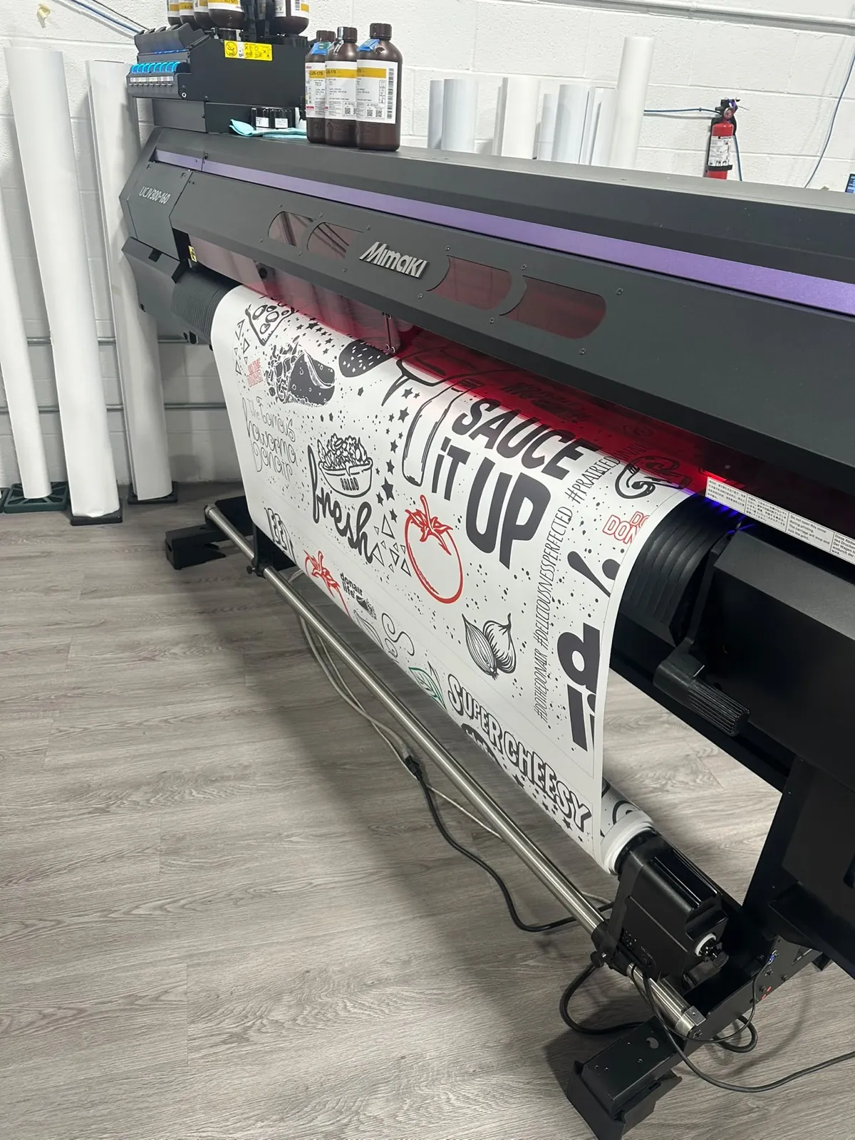 Wide format printer running the black and white doodle wall mural