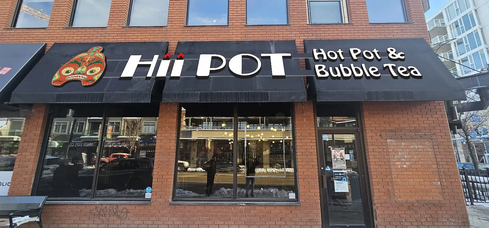 Hii Pot Hot Pot and Bubble Tea storefront awnings with lit letters, wide view