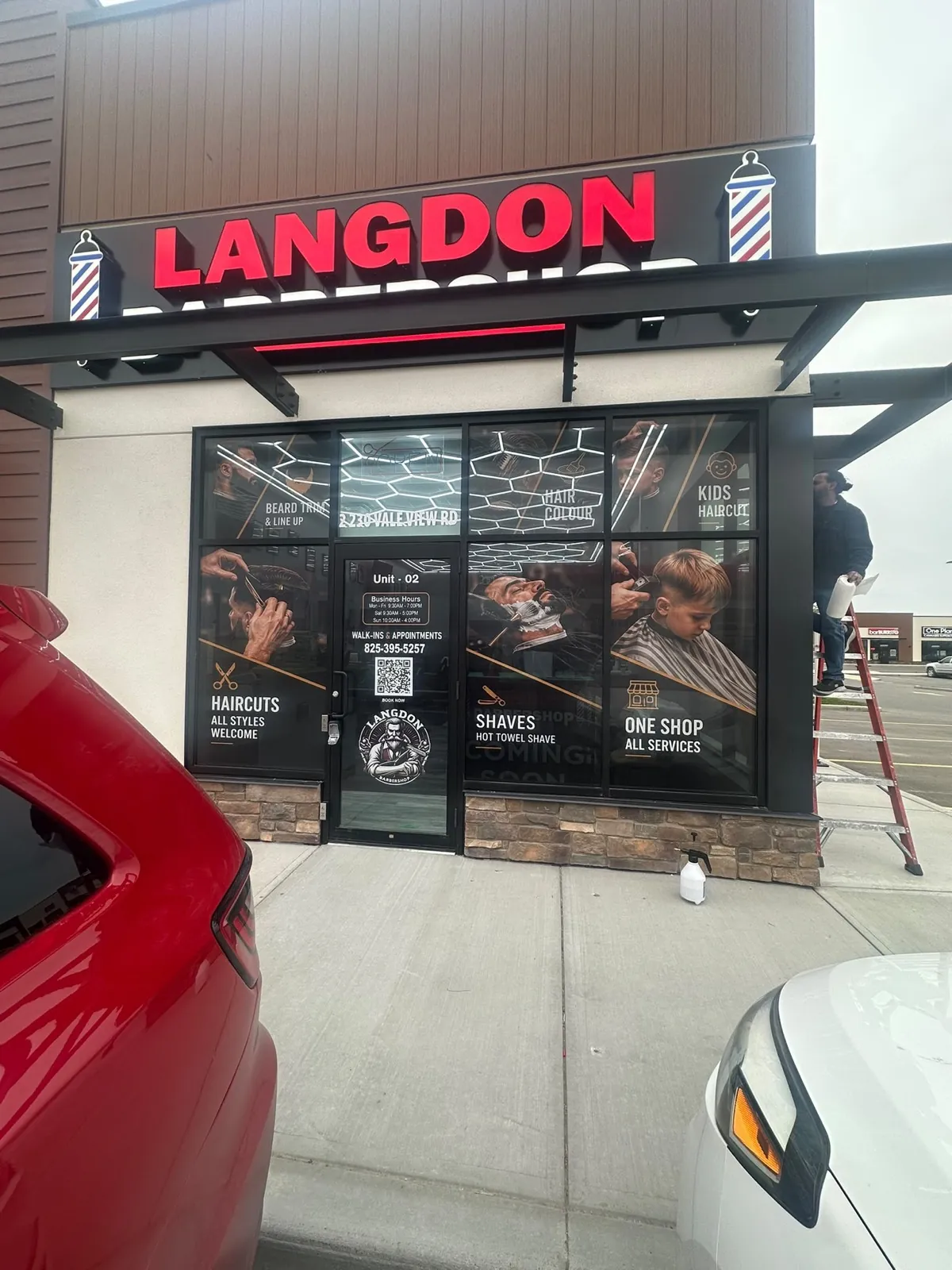 Langdon Barbershop full window wrap with services and logo decals