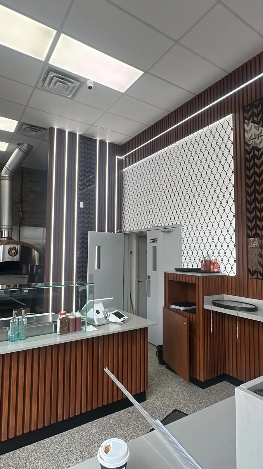 Mr. Meat Pie counter and backlit feature walls inside the restaurant