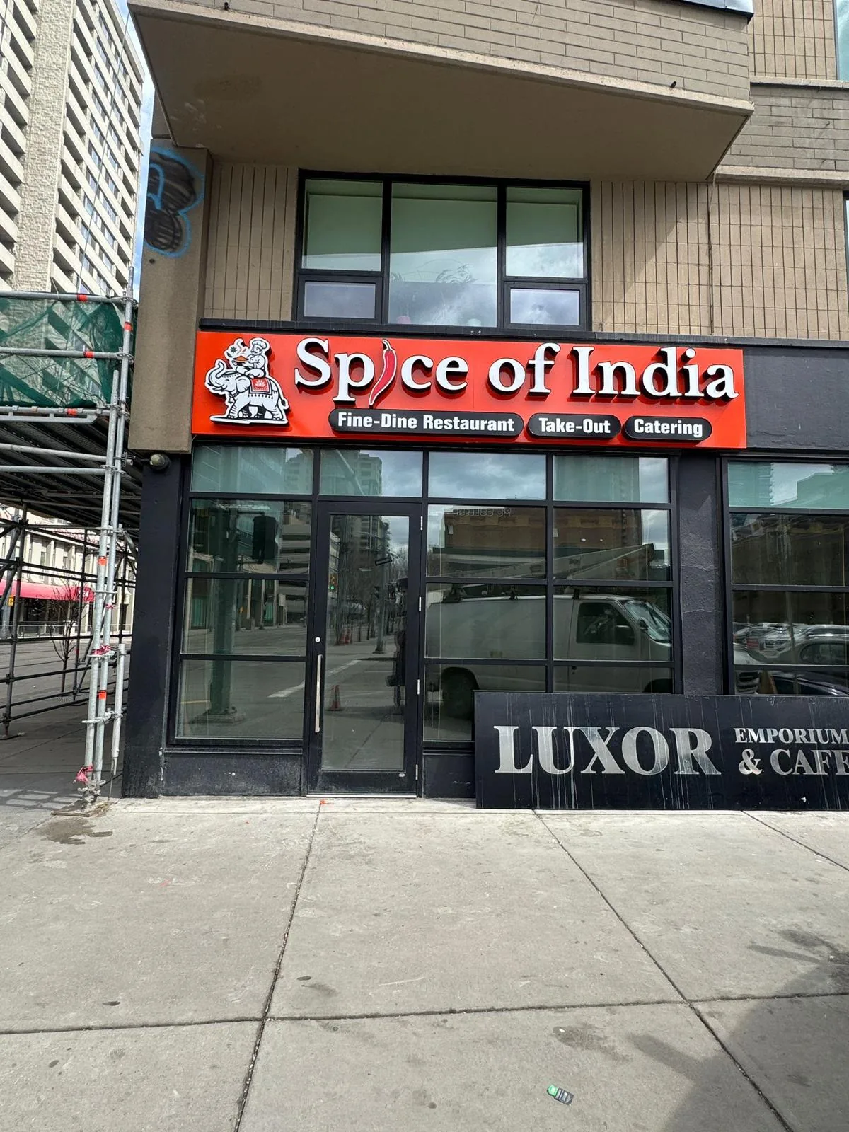 Spice of India red illuminated lightbox storefront sign