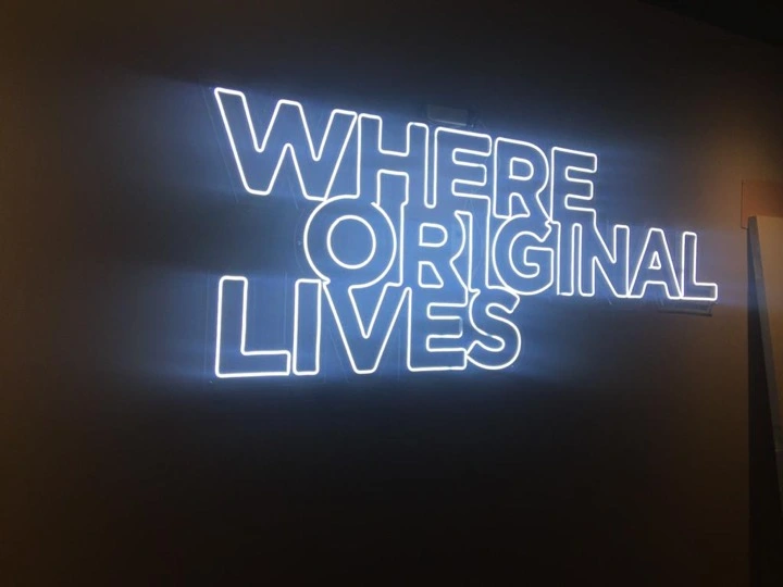 Where Original Lives custom neon feature wall