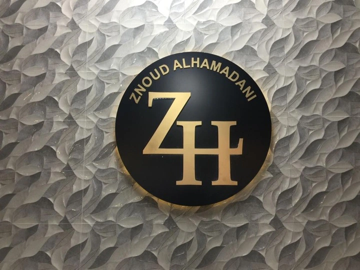 Znoud Alhamadani gold and black dimensional logo